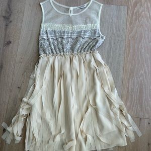 Cream mini dress - lace top with movement on lower part